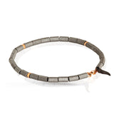 MANO J. BRACCIALE A CILINDRI PICCOLI IN TITANIO E 3 RONDELLE ORO ROSSO 9 KT