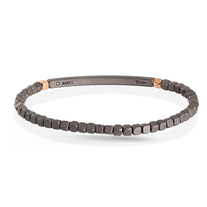 BRACCIALE A MOLLA CON CUBI E BARRETTA IN TITANIO, 2 CUBI ORO 9 KT E 25 BLACK